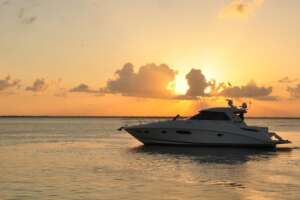 Boat rental Marina Sunrise Cancun yacht cruising in calm lagoon water