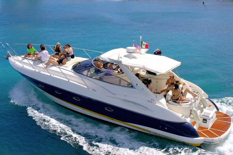 Boat rental Puerto Morelos yacht near coral reef in calm Caribbean water